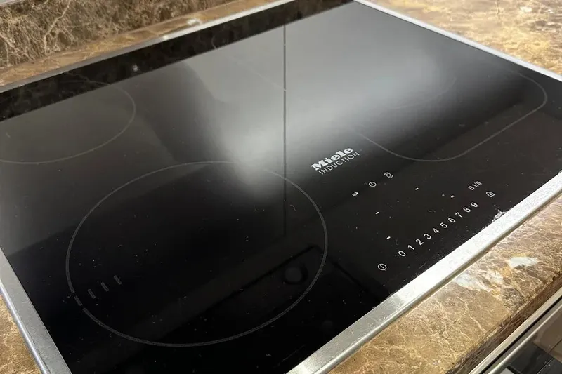  Yacht Photos Pics Miele induction cooktop on marble countertop, Sunseeker 95 yacht, 2018 model.