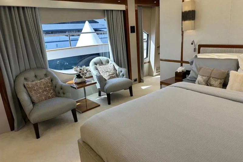  Yacht Photos Pics Luxurious 2018 Sunseeker 95 yacht bedroom with elegant decor and ocean view.