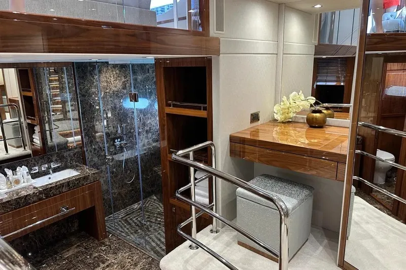  Yacht Photos Pics Luxurious interior of 2018 Sunseeker 95 yacht featuring elegant bathroom and vanity area.