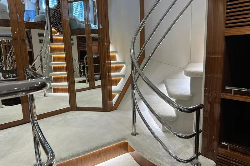  Yacht Photos Pics Luxurious interior of 2018 Sunseeker 95 yacht with elegant spiral staircase.