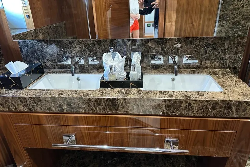  Yacht Photos Pics Luxurious marble bathroom vanity with dual sinks on a 2018 Sunseeker 95 yacht.