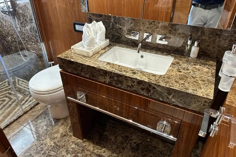  Yacht Photos Pics Luxurious bathroom in 2018 Sunseeker 95 yacht with marble countertop and modern fixtures.