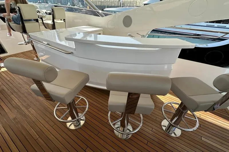  Yacht Photos Pics Luxurious Sunseeker 95 yacht interior with sleek bar and modern seating, 2018 model.