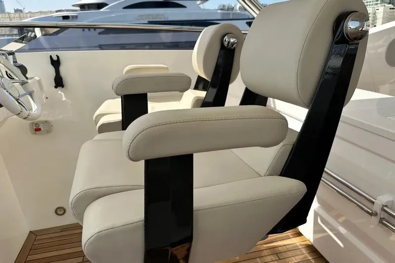  Yacht Photos Pics Luxury seating on 2018 Sunseeker 95 yacht, featuring sleek design and comfort.