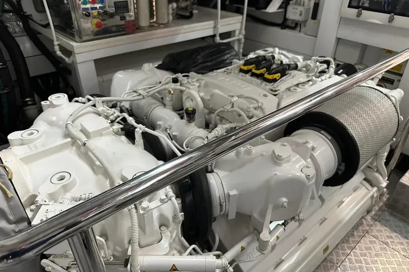  Yacht Photos Pics Engine room of a 2018 Sunseeker 95 yacht, showcasing intricate machinery and components.