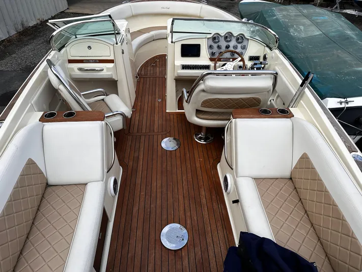  Yacht Photos Pics 2014 Chris-Craft 28 LAUNCH boat interior with luxurious seating and wooden flooring.