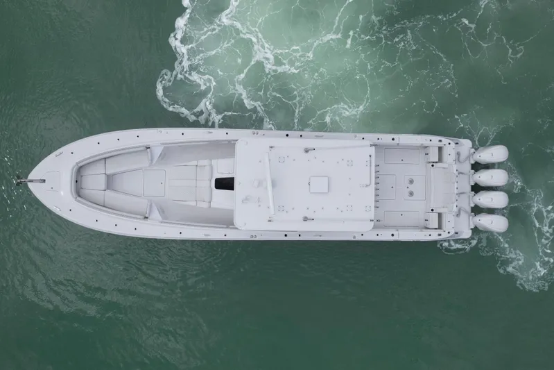 Our Trade Yacht Photos Pics Top view of 2024 HCB 53 Sueños boat on green water.