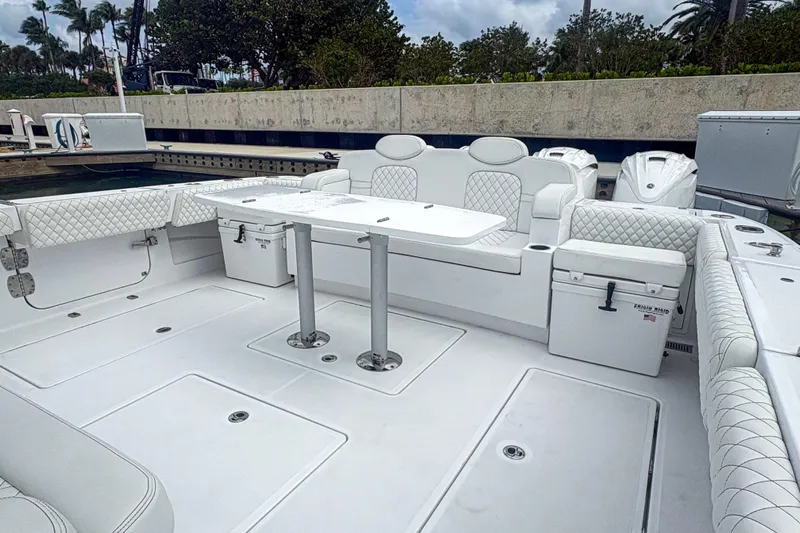 Our Trade Yacht Photos Pics Luxurious 2024 HCB 53 Sueños boat interior with white seating and table.