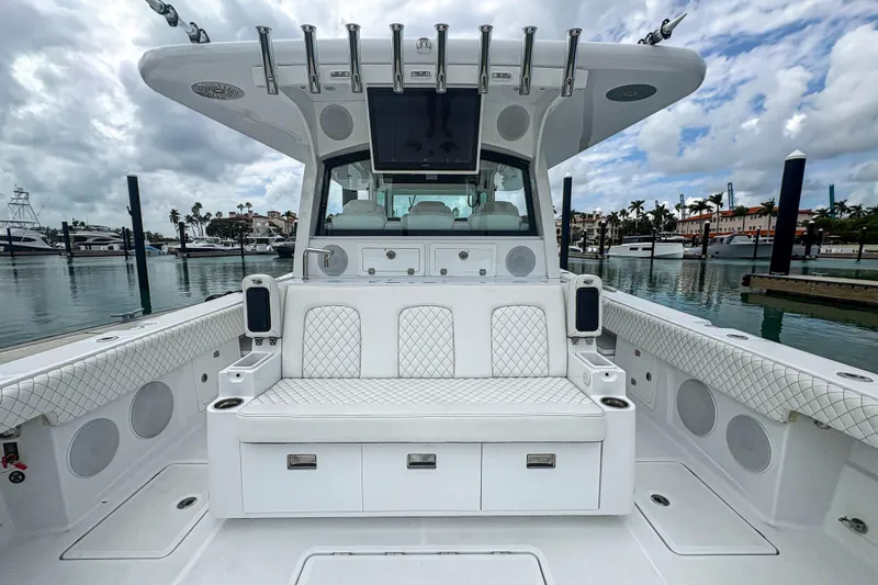 Our Trade Yacht Photos Pics 2024 HCB 53 Sueños boat interior with luxurious seating and fishing rod holders.