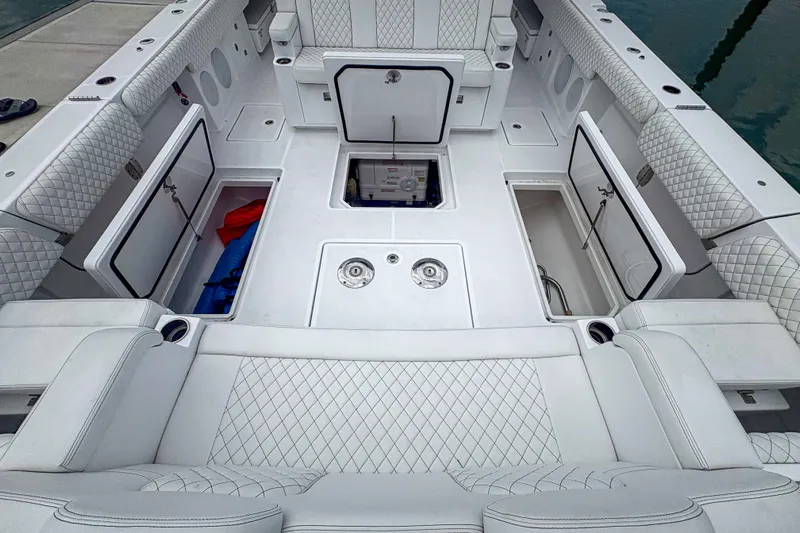 Our Trade Yacht Photos Pics 2024 HCB 53 Sueños boat interior with open storage compartments and quilted seating.