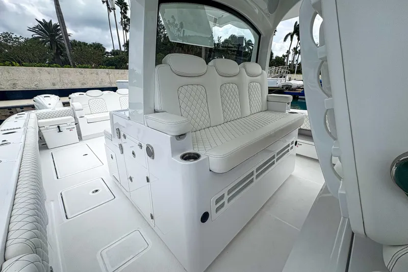 Our Trade Yacht Photos Pics 2024 HCB 53 Sueños luxury boat interior with white quilted seating and modern design.