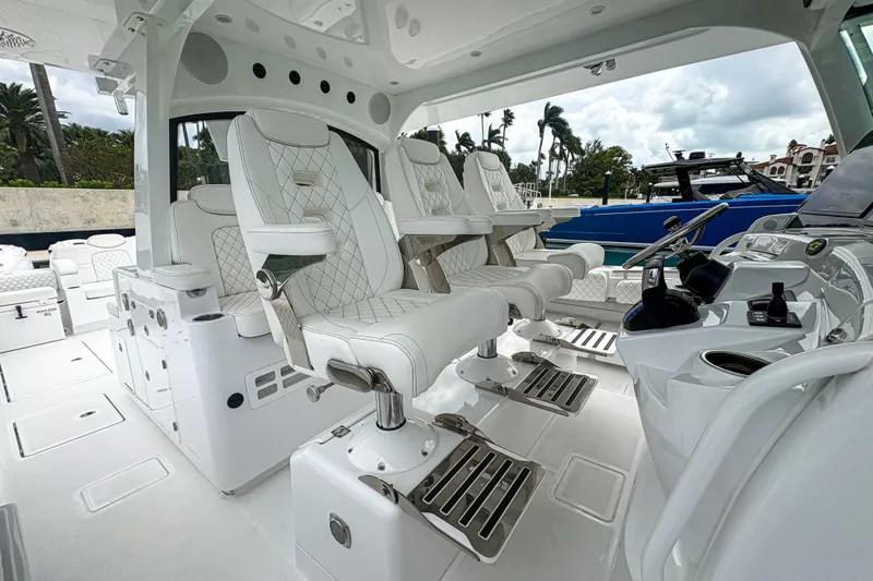 Our Trade Yacht Photos Pics 2024 HCB 53 Sueños luxury boat interior with plush seating and modern helm controls.