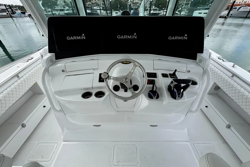 Our Trade Yacht Photos Pics Helm of 2024 HCB 53 Sueños with Garmin displays and steering wheel.