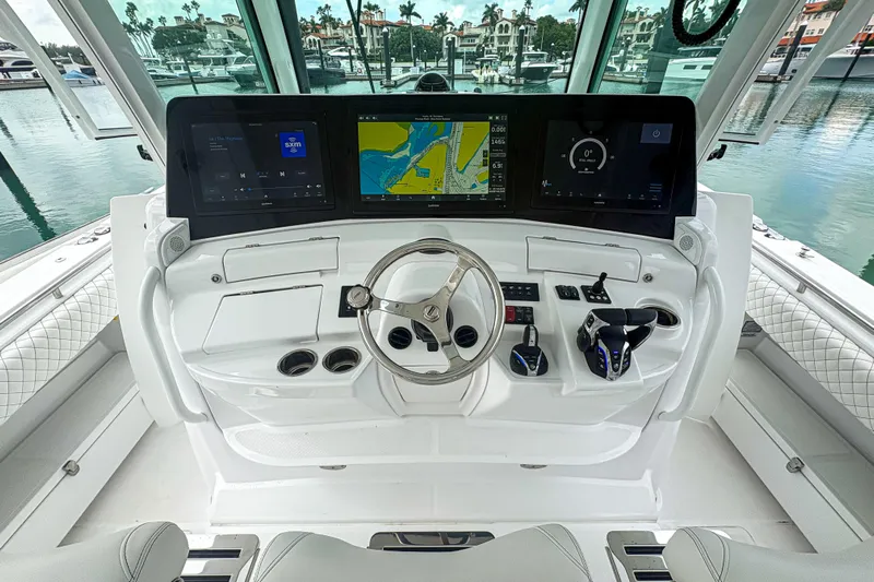 Our Trade Yacht Photos Pics 2024 HCB 53 Sueños boat helm with advanced navigation displays and controls.