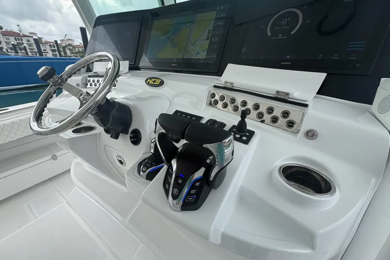 Our Trade Yacht Photos Pics 2024 HCB 53 Sueños boat helm with advanced navigation controls and steering wheel.