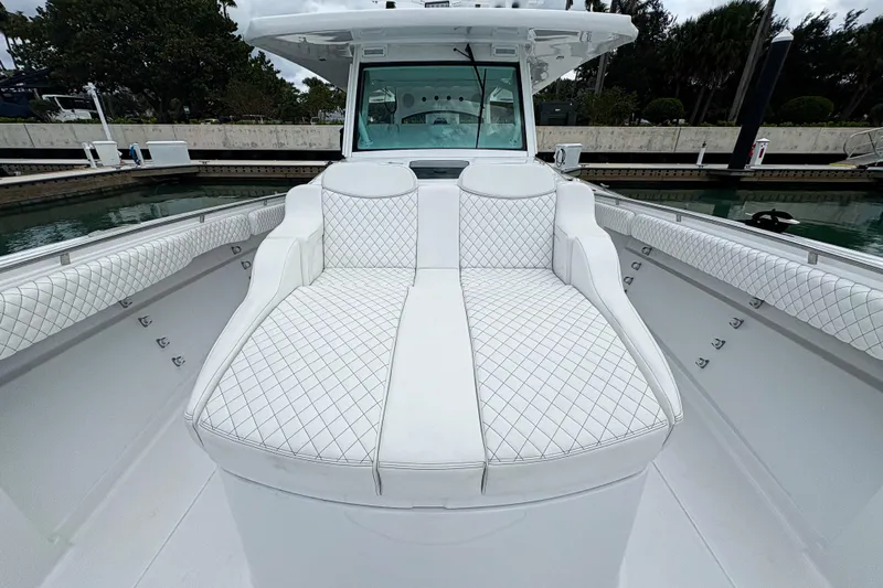 Our Trade Yacht Photos Pics 2024 HCB 53 Sueños boat with luxurious white seating and quilted upholstery.