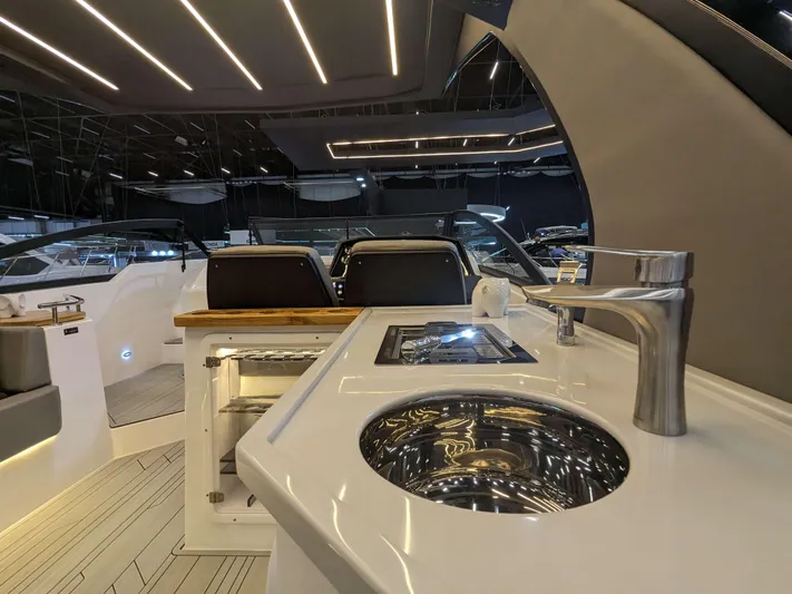 Custom Order Your 347 Today! Yacht Photos Pics 2025 Hanover 347 Inboard yacht interior with modern sink and sleek design.