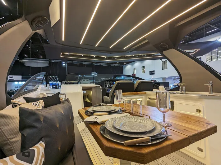 Custom Order Your 347 Today! Yacht Photos Pics Luxurious interior of 2025 Hanover 347 Inboard yacht with elegant dining setup.