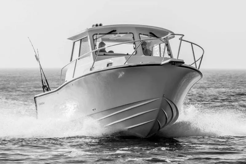  Yacht Photos Pics Manufacturer Provided Image: 2025 NorthCoast 285 HT boat cruising on open water, front view.