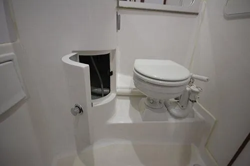  Yacht Photos Pics Manufacturer Provided Image: 2025 NorthCoast 285 HT boat bathroom with compact toilet and storage cabinet.