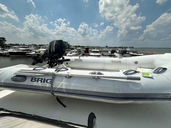 Dawn Yacht Photos Pics Inflatable boat with Mercury motor on Carver 440 Aft Cabin Motor Yacht, 1995 model.