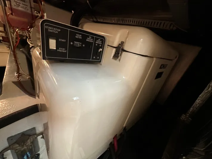 Dawn Yacht Photos Pics Engine room of 1995 Carver 440 Aft Cabin Motor Yacht with control panel.