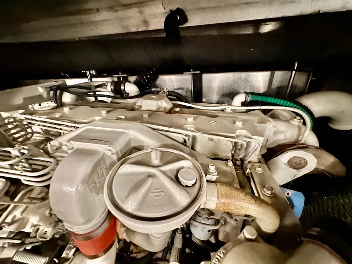 Dawn Yacht Photos Pics Engine compartment of 1995 Carver 440 Aft Cabin Motor Yacht, showcasing mechanical components.