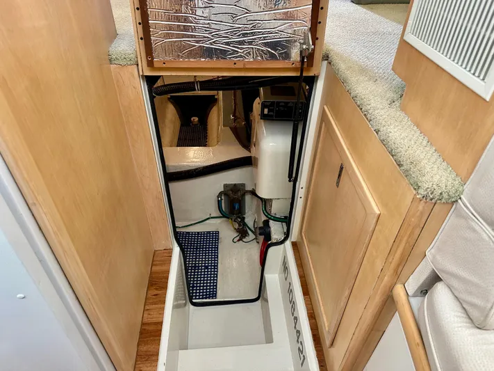Dawn Yacht Photos Pics 1995 Carver 440 Aft Cabin Motor Yacht interior showing engine compartment access.