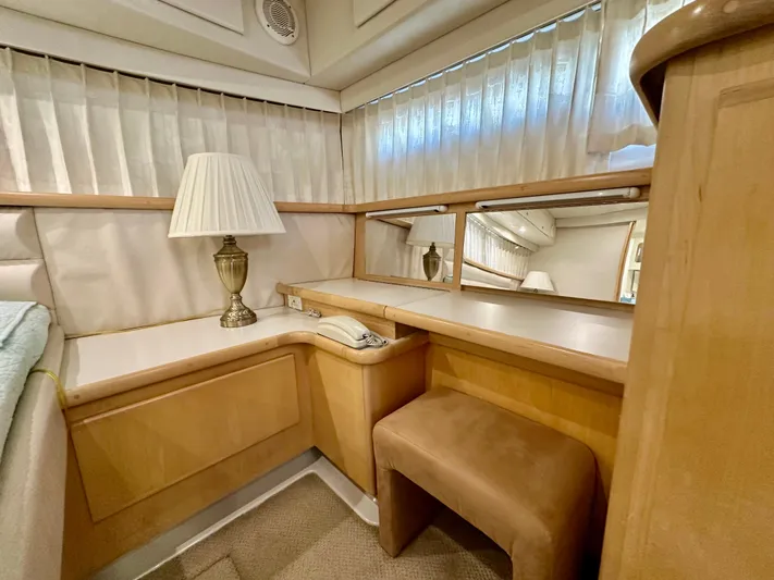 Dawn Yacht Photos Pics 1995 Carver 440 Aft Cabin Motor Yacht interior with vanity, lamp, and mirror.