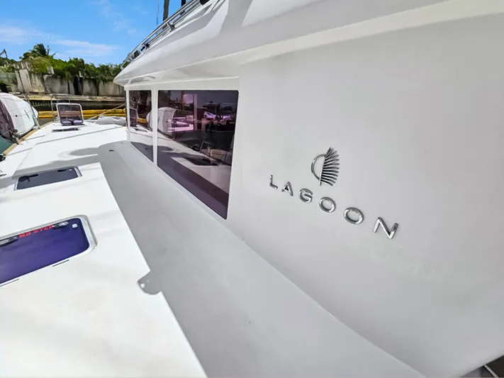 Cool Runnings IV Yacht Photos Pics Lagoon 560 S2 yacht, 2015 model, featuring sleek white exterior and logo.