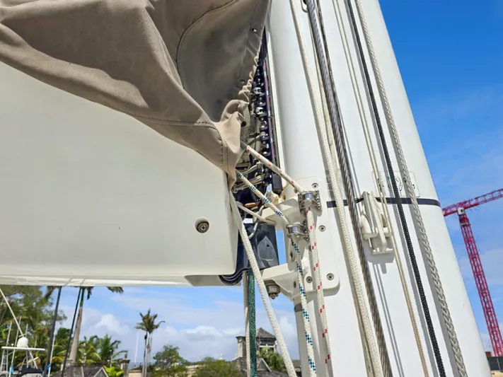 Cool Runnings IV Yacht Photos Pics Close-up of a 2015 Lagoon 560 S2 sailboat mast and rigging against a blue sky.