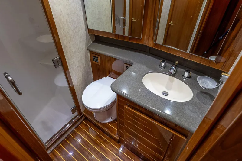 Peeling Drag Yacht Photos Pics Luxurious bathroom in 2003 Egg Harbor 42 Convertible yacht with modern fixtures and wood accents.