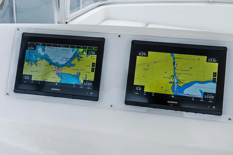 Peeling Drag Yacht Photos Pics Dual Garmin navigation screens on 2003 Egg Harbor 42 Convertible yacht dashboard.