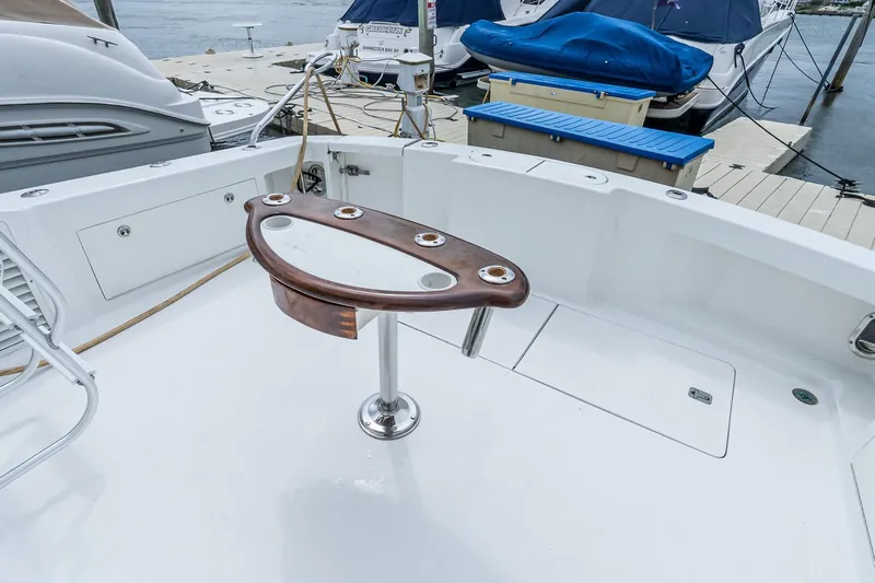 Peeling Drag Yacht Photos Pics 2003 Egg Harbor 42 Convertible yacht deck with rod holders and dock view.