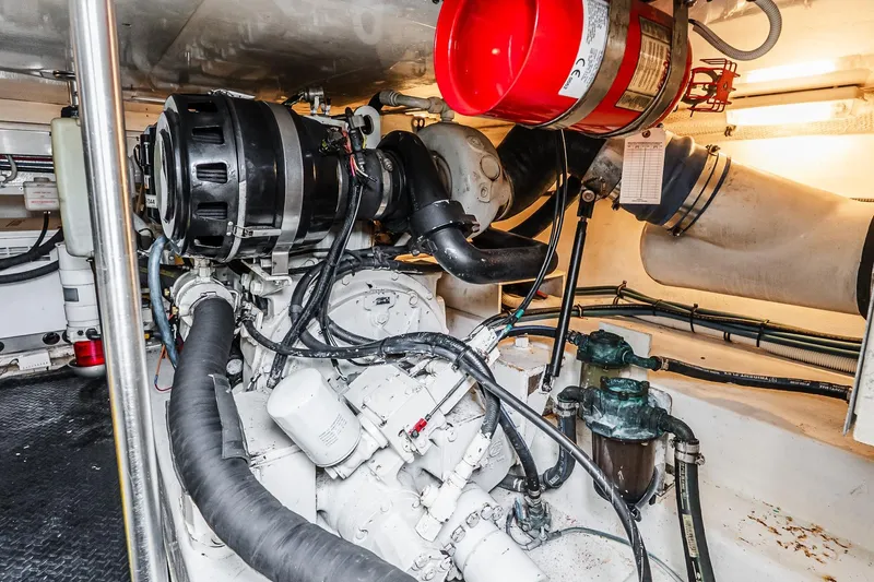 Peeling Drag Yacht Photos Pics Engine room of 2003 Egg Harbor 42 Convertible yacht, showcasing mechanical components and systems.