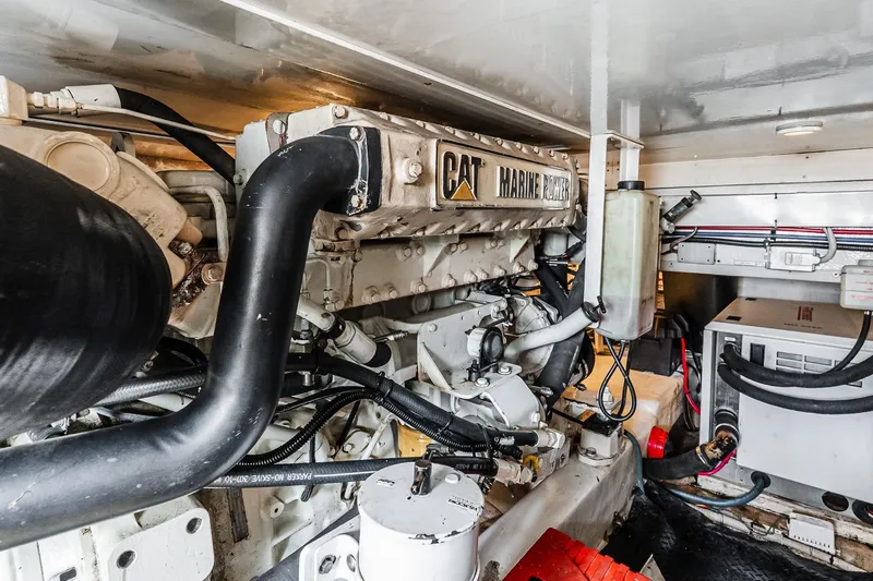 Peeling Drag Yacht Photos Pics Engine room of 2003 Egg Harbor 42 Convertible with CAT marine engine.