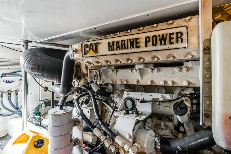 Peeling Drag Yacht Photos Pics Engine room of 2003 Egg Harbor 42 Convertible with CAT Marine Power engine.