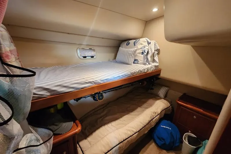 Plane Pirate Yacht Photos Pics 2004 Riviera 37 Convertible cabin with bunk beds and cozy interior.