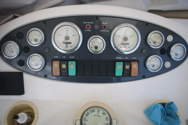 Plane Pirate Yacht Photos Pics Dashboard of a 2004 Riviera 37 Convertible boat with gauges and controls.