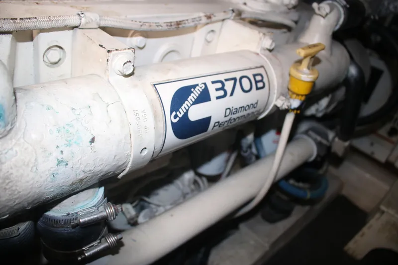 Plane Pirate Yacht Photos Pics Engine component of a 2004 Riviera 37 Convertible, featuring Cummins 370B Diamond Performance.
