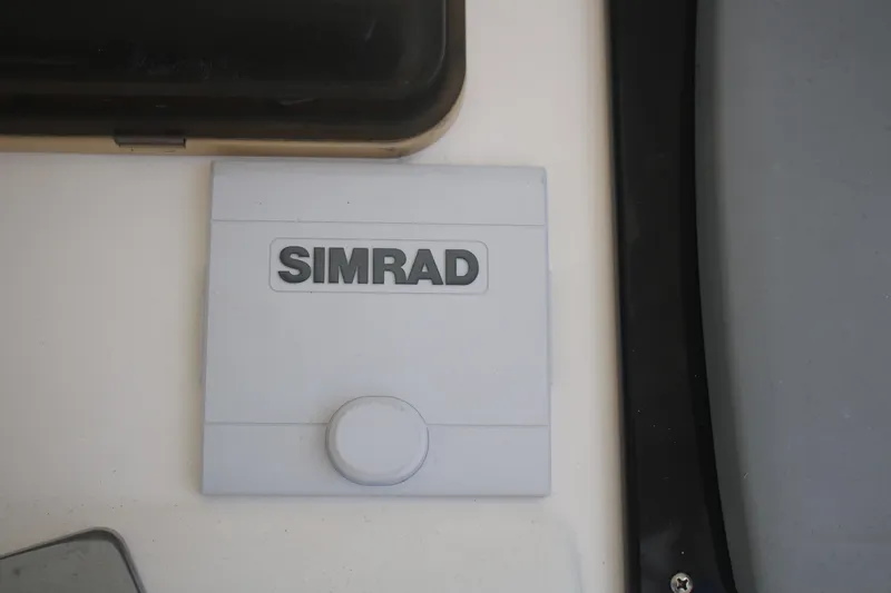Plane Pirate Yacht Photos Pics Simrad device on 2004 Riviera 37 Convertible boat dashboard.