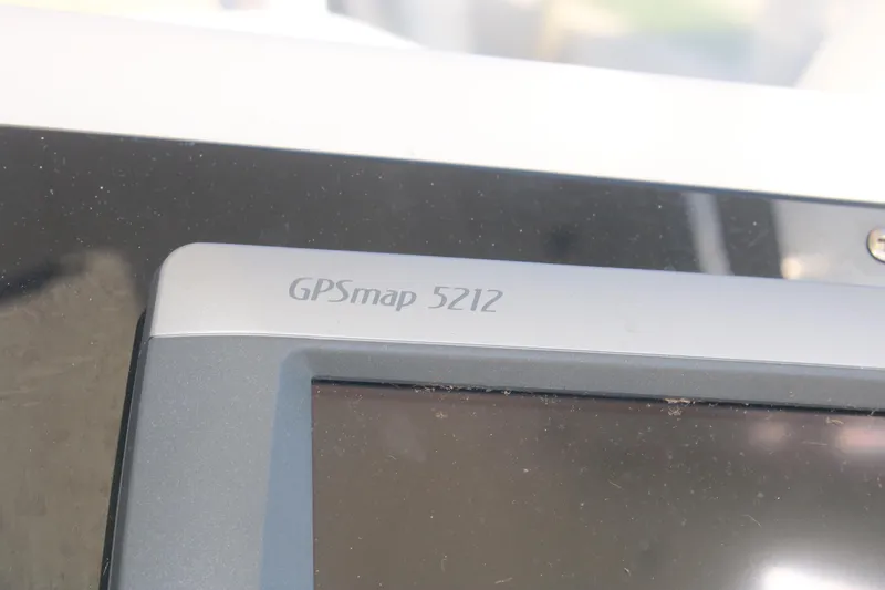 Plane Pirate Yacht Photos Pics GPSmap 5212 device on 2004 Riviera 37 Convertible boat dashboard.