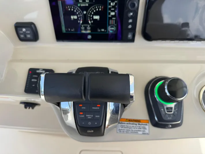  Yacht Photos Pics Control panel of a 2018 Boston Whaler 330 Outrage boat with throttle and joystick.