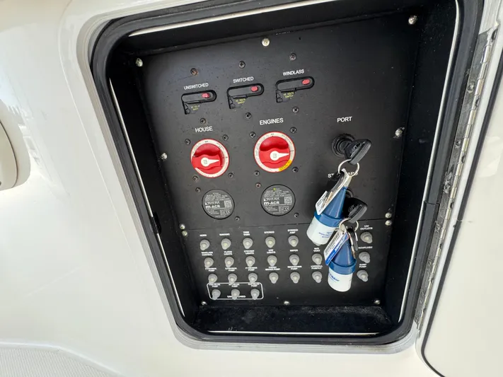  Yacht Photos Pics Control panel of a 2018 Boston Whaler 330 Outrage boat with switches and keys.
