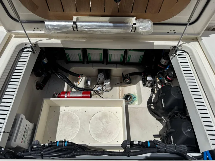  Yacht Photos Pics 2018 Boston Whaler 330 Outrage engine compartment with wiring, fire extinguisher, and equipment.