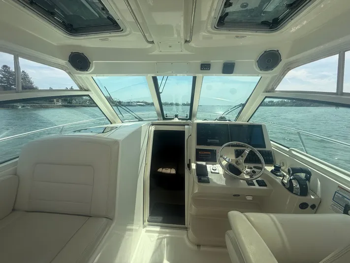  Yacht Photos Pics 2018 Boston Whaler 345 Conquest helm with modern controls and panoramic water view.