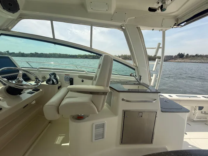  Yacht Photos Pics 2018 Boston Whaler 345 Conquest helm with luxurious seating and ocean view.