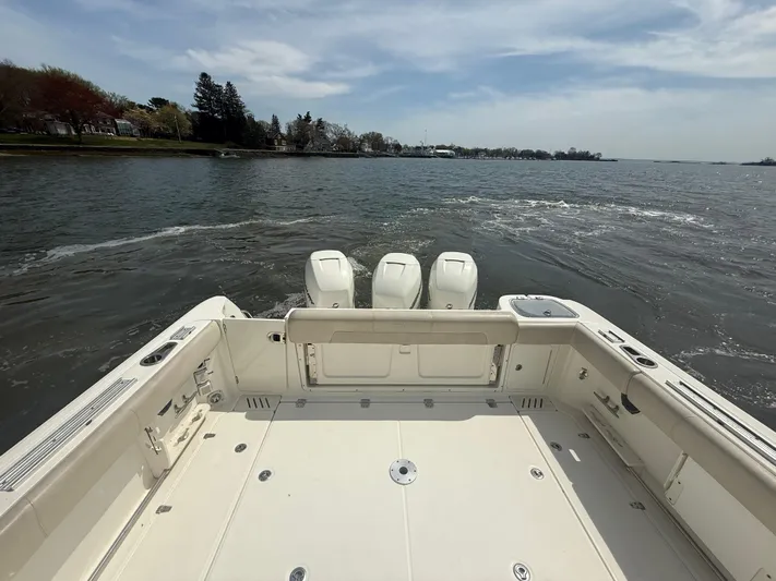  Yacht Photos Pics 2018 Boston Whaler 345 Conquest boat with triple engines on open water.