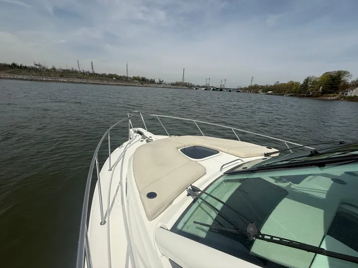  Yacht Photos Pics 2018 Boston Whaler 345 Conquest cruising on a calm river under a clear sky.