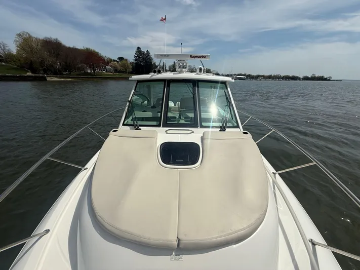  Yacht Photos Pics 2018 Boston Whaler 345 Conquest boat on calm water, showcasing sleek design and spacious deck.